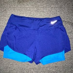 Nike blue athletic shorts with spandex